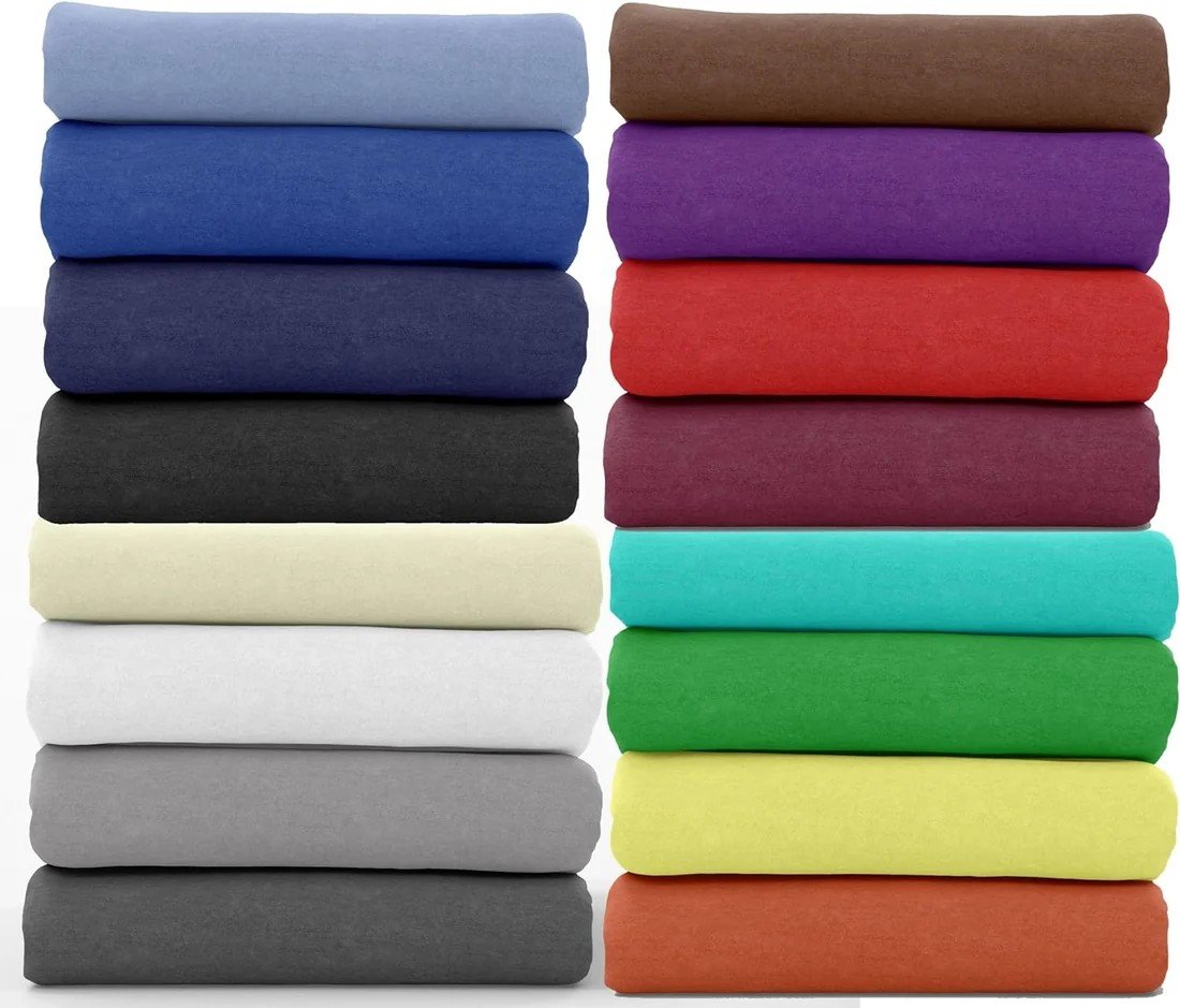 Stacks of folded fabric in several colours