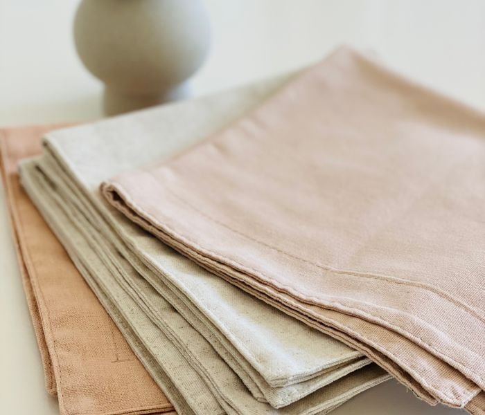 Folded neutral-colour bed linens