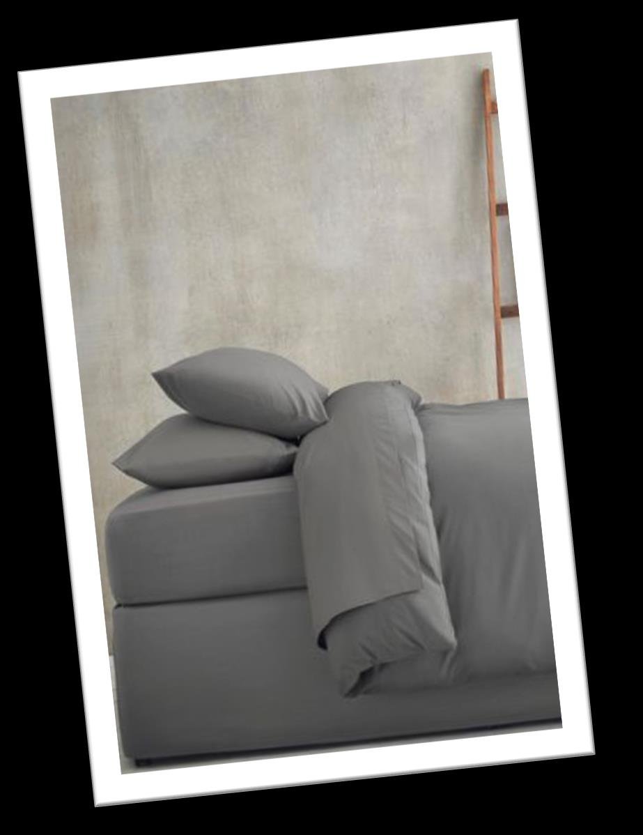 Sheet set in grey on bed | Raghuvir Lifestyle Sheet set in grey on bed