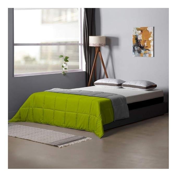 Quilt in green on bed | Raghuvir Lifestyle Quilt in green on bed