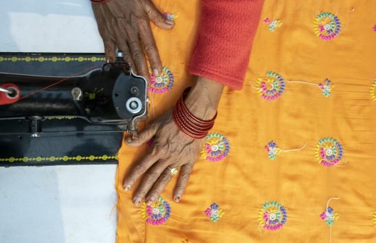 close-up-woman-working-sewing-machine